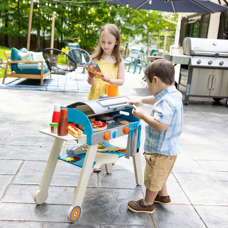 Melissa & Doug Our Top Pretend Play Food Toys for Summer Fun blog post kids playing with Top & Bake Pizza Counter