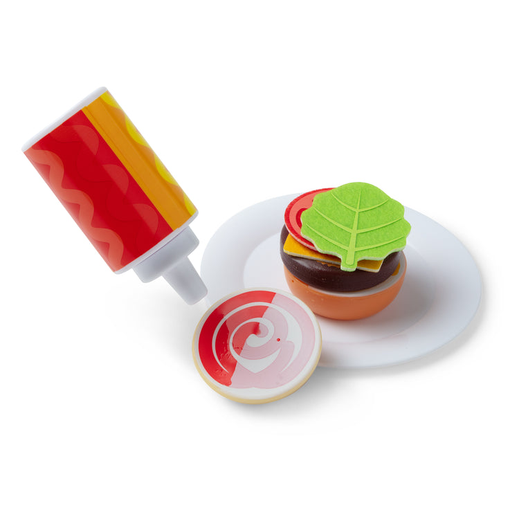 A playroom scene with The Melissa & Doug Flip & Fry Grill Play Set with Water WOW!® Color Reveal Play Food Preschool Toy Ages 3+