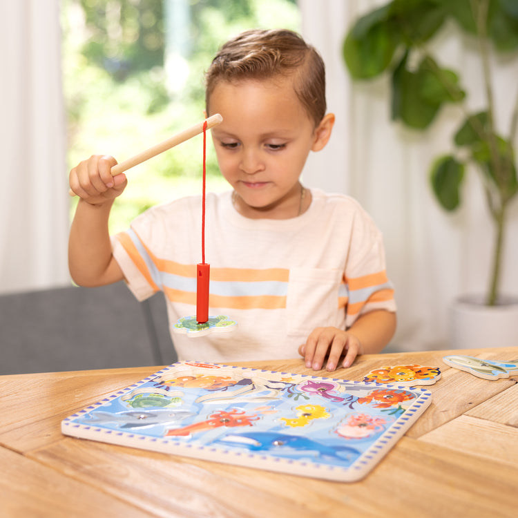 A playroom scene with The Melissa & Doug Magnetic Wooden Fishing Game and Puzzle With Wooden Ocean Animal Magnets