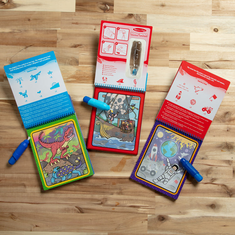 A playroom scene with The Melissa & Doug Water WOW! 3-Pack – Dinosaur, Adventure, Space Water-Reveal Travel Activity Pads