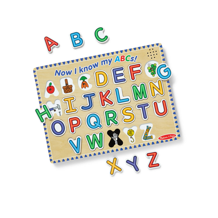 The loose pieces of The Melissa & Doug Wooden Alphabet Sound Puzzle - Wooden Puzzle With Light-Activated Sound Effects (26 pcs)
