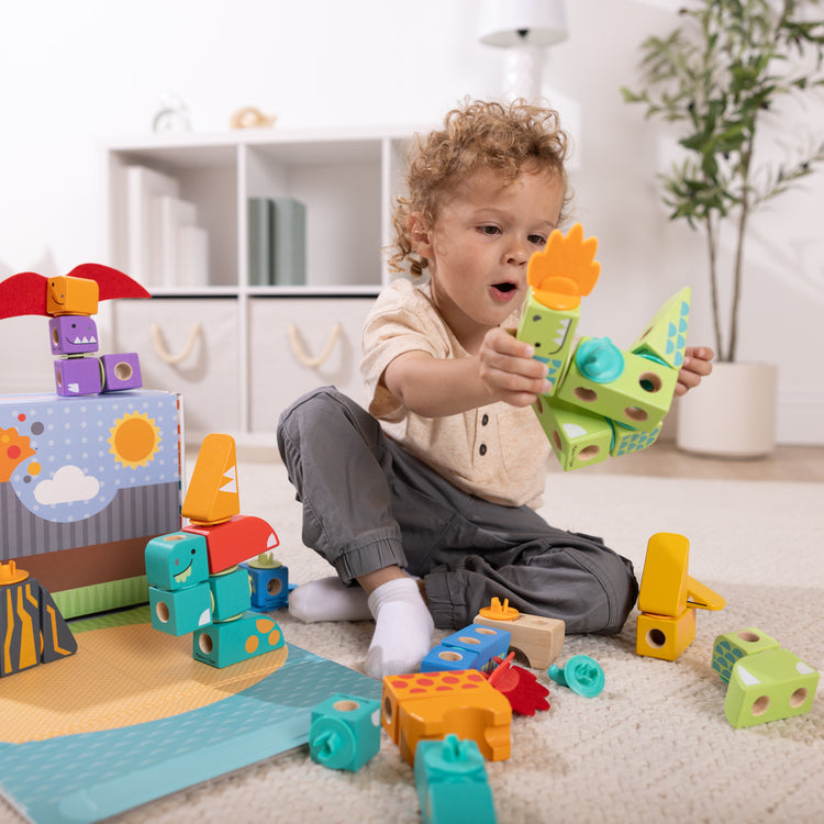 A playroom scene with The Melissa & Doug Blockables™ Dinosaur Snap And Play, Mix And Match Connectable Wooden Building Blocks Play Set Toy for Preschool Boys And Girls (69 Pcs)
