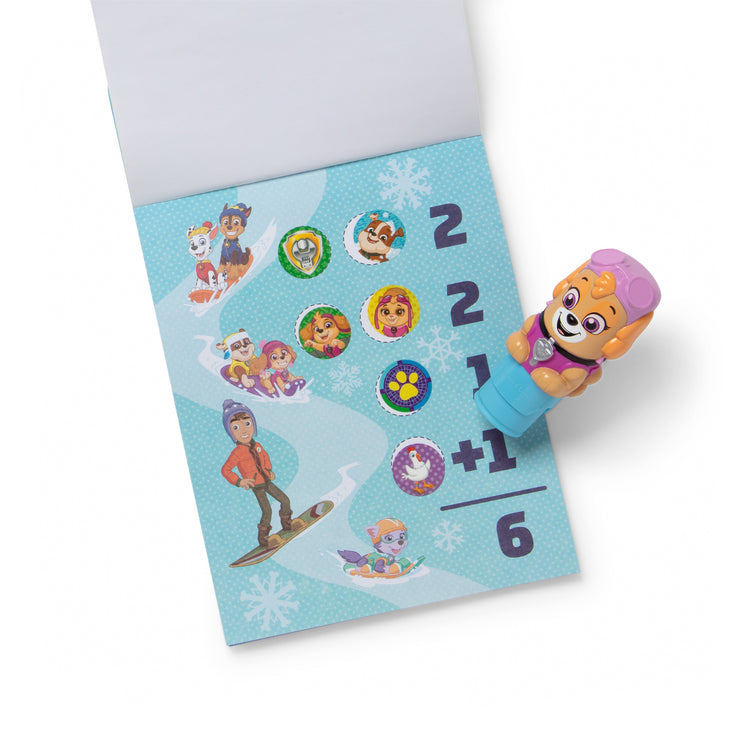 The loose pieces of The Melissa & Doug Sticker WOW!™ 24-Page Activity Pad and Sticker Stamper, 300 Stickers, Arts and Crafts Fidget Toy Collectible Character – PAW Patrol Skye