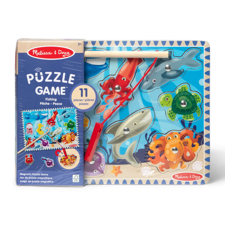 The loose pieces of The Melissa & Doug Magnetic Wooden Fishing Game and Puzzle With Wooden Ocean Animal Magnets