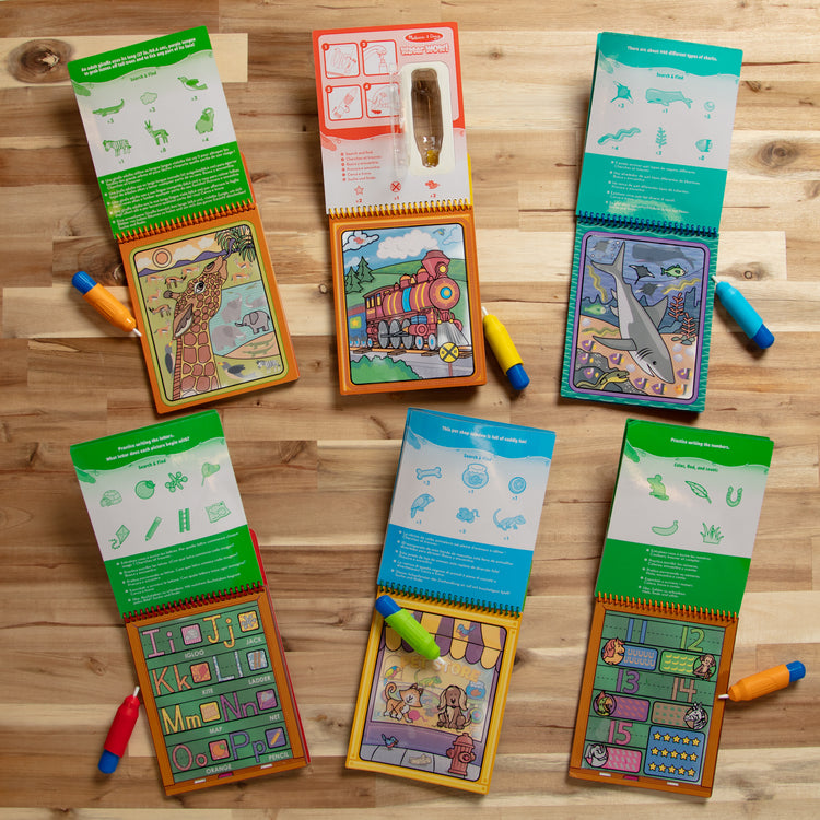 A playroom scene with The Water WOW! Bundle 6-Pack: Animals, Vehicles, Alphabet, Numbers, Safari, Under the Sea