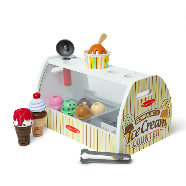 An assembled or decorated image of The Melissa & Doug Wooden Scoop and Serve Ice Cream Counter With Play Food and Accessories (28 Pcs)
