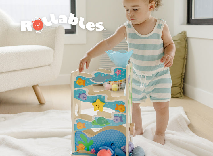 image of child playing with rollables
