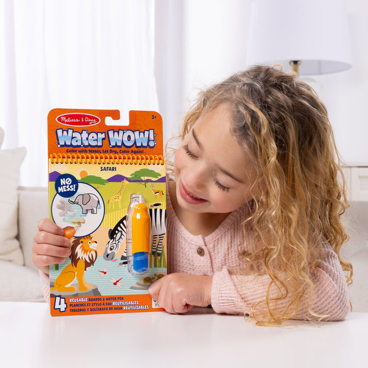 A kid playing with The Water WOW! Bundle 6-Pack: Animals, Vehicles, Alphabet, Numbers, Safari, Under the Sea