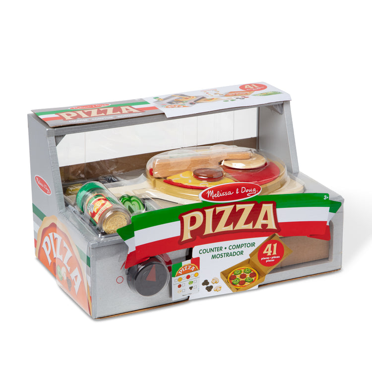The front of the box for The Melissa & Doug Top & Bake Wooden Pizza Counter Play Set with Play Food (41 Pcs) Preschool Toy