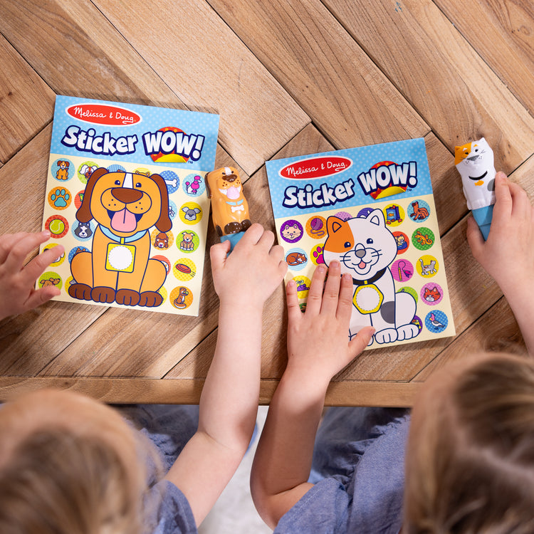 A kid playing with The Melissa & Doug Sticker WOW!® Pets (Dog and Cat) VALUE PACK Arts and Crafts Collectibles – 2 Activity Pads, 2 Sticker Stampers, 2 Bonus Sticker Stacks