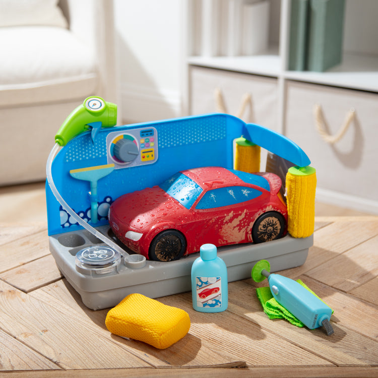 A playroom scene with The Melissa & Doug Spray & Shine Car Wash Color-Changing Water Toy Play Set Boys and Girls 3+