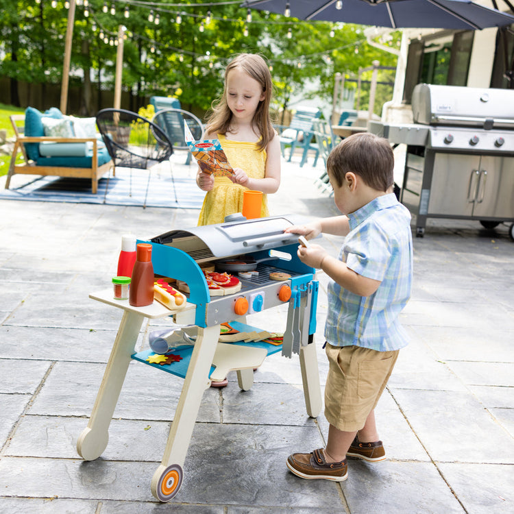 Melissa & Doug Our Top Pretend Play Food Toys for Summer Fun blog post kids playing with Top & Bake Pizza Counter