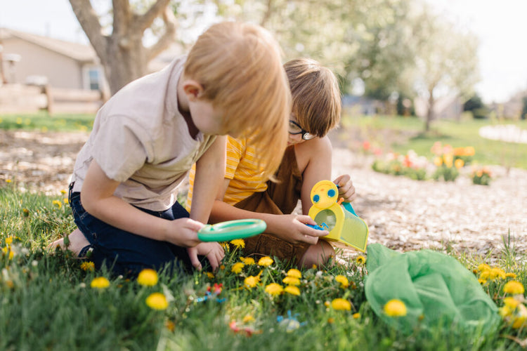 kids outside playing with outdoor toys