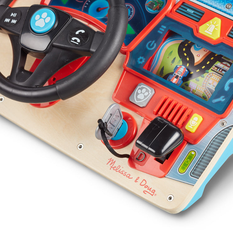 The loose pieces of The Melissa & Doug PAW Patrol Rescue Mission Wooden Dashboard