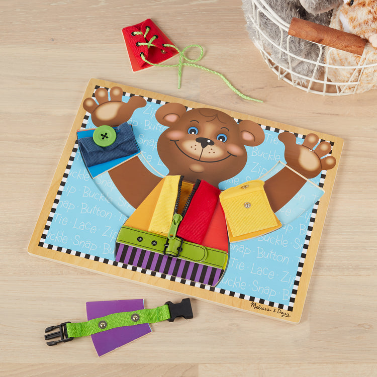 A playroom scene with The Melissa & Doug Basic Skills Puzzle Board - Wooden Educational Toy