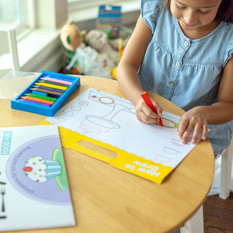 A kid playing with The Melissa & Doug Playmats Animals Take-Along Paper Coloring And Learning Activity Pads (24 Pages)