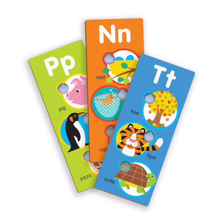 The loose pieces of The Melissa & Doug Poke-a-Dot Alphabet Learning Cards