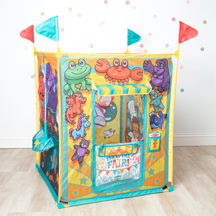 A playroom scene with The Melissa & Doug Fun at the Fair! Game Center Play Tent – 4 Sides of Activities