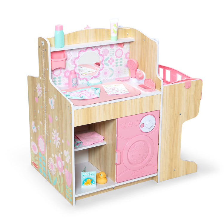 The loose pieces of The Melissa & Doug Baby Care Center and Accessory Sets