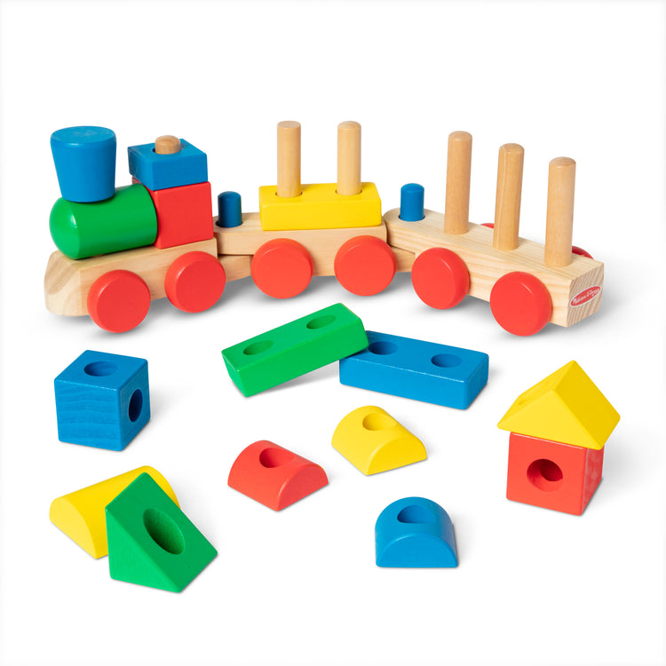 The loose pieces of The Melissa & Doug Wooden Stacking Train Learning Toy Vehicle With 18 Connecting Pcs