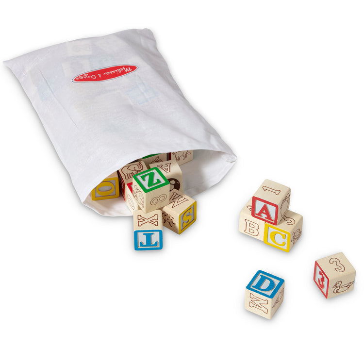 The loose pieces of The Melissa & Doug Deluxe Wooden ABC/123 1-Inch Blocks Set With Storage Pouch (50 pcs)