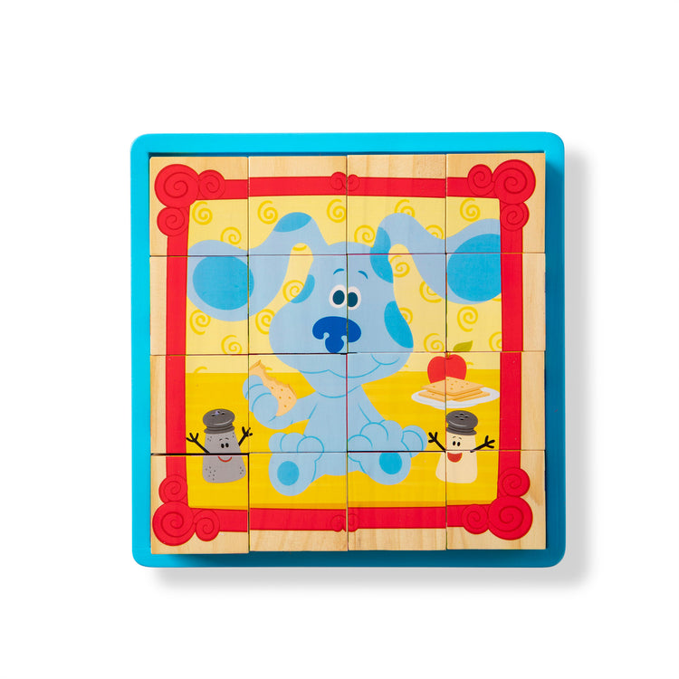 The loose pieces of The Melissa & Doug Blue's Clues & You! Wooden Cube Puzzle (16 Pieces)