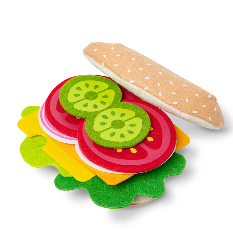 The loose pieces of The Melissa & Doug Felt Food Sandwich Play Food Set (33 pcs)