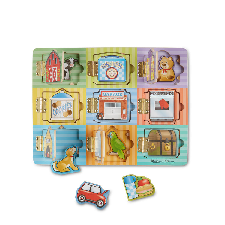 The loose pieces of The Melissa & Doug Hide and Seek Wooden Activity Board With Wooden Magnets