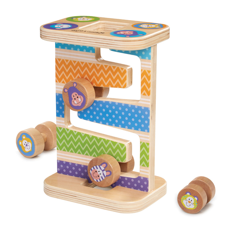 The loose pieces of The Melissa & Doug First Play Wooden Safari Zig-Zag Tower With 4 Rolling Pieces