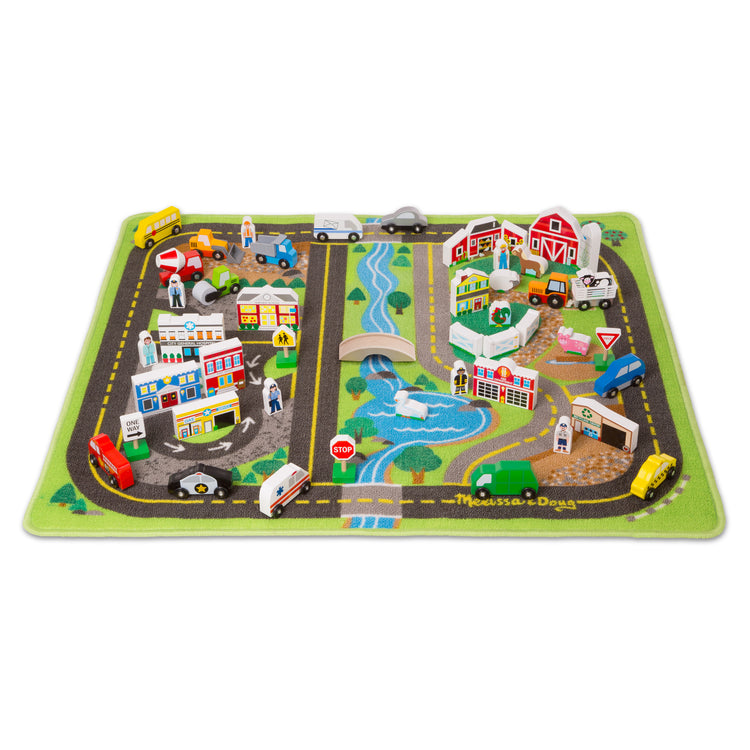 The loose pieces of The Melissa & Doug Deluxe Activity Road Rug Play Set with 49 Wooden Vehicles and Play Pieces