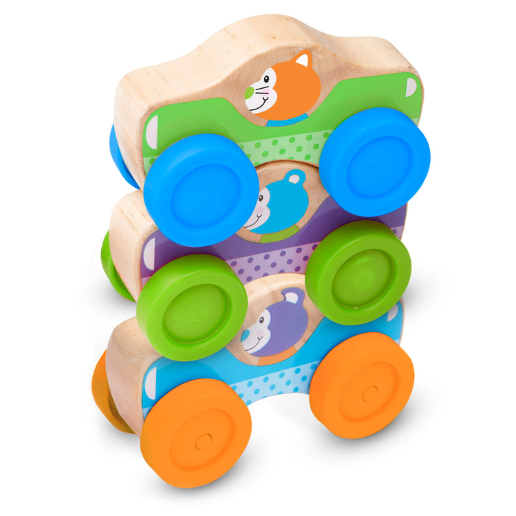 The loose pieces of The Melissa & Doug First Play Wooden Animal Stacking Cars (3 pcs)