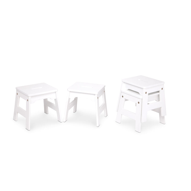 An assembled or decorated image of The Melissa & Doug Wooden Stools – Set of 4 Stackable, Portable 11-Inch-Tall Stools (White)