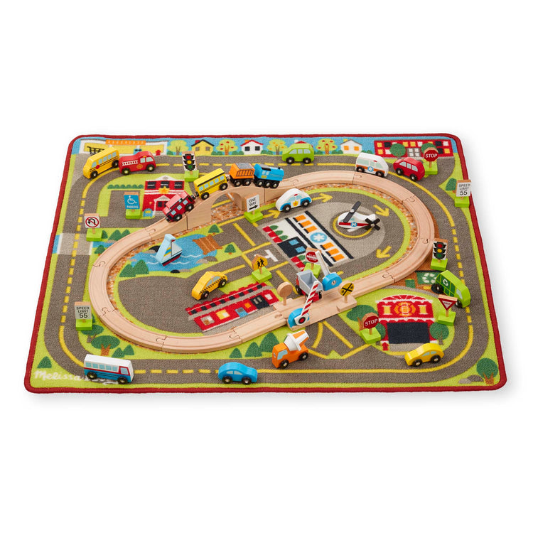 The loose pieces of The Melissa & Doug Deluxe Multi-Vehicle Activity Rug (39.5" x 36.5") - 19 Vehicles, 12 Wooden Signs, Train Tracks