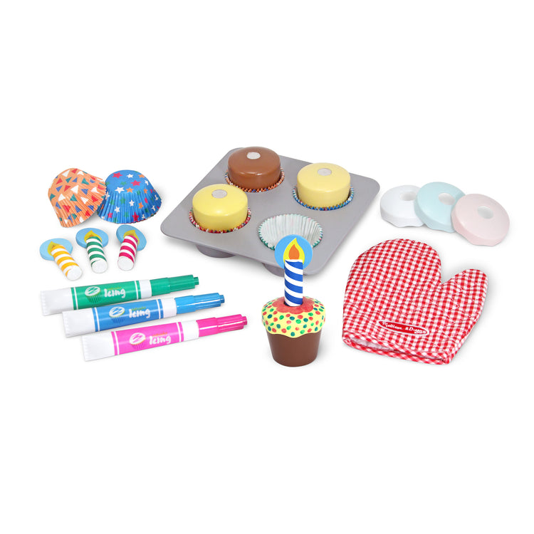 The loose pieces of The Melissa & Doug Bake and Decorate Wooden Cupcake Play Food Set