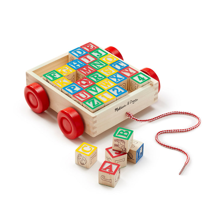 The loose pieces of The Melissa & Doug Classic ABC Wooden Block Cart Educational Toy With 30 1-Inch Solid Wood Blocks