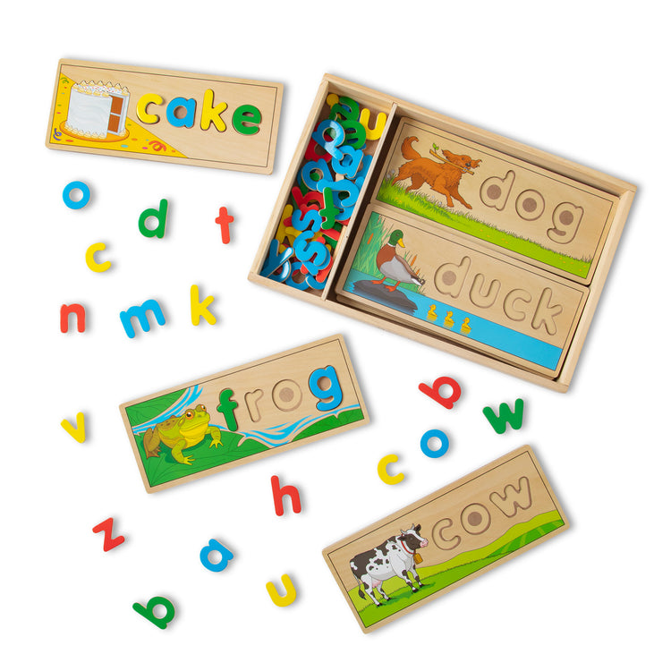 The loose pieces of The Melissa & Doug See & Spell Wooden Educational Toy With 8 Double-Sided Spelling Boards and 64 Letters