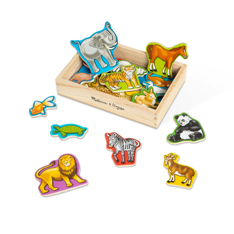 The loose pieces of The Melissa & Doug 20 Wooden Animal Magnets in a Box