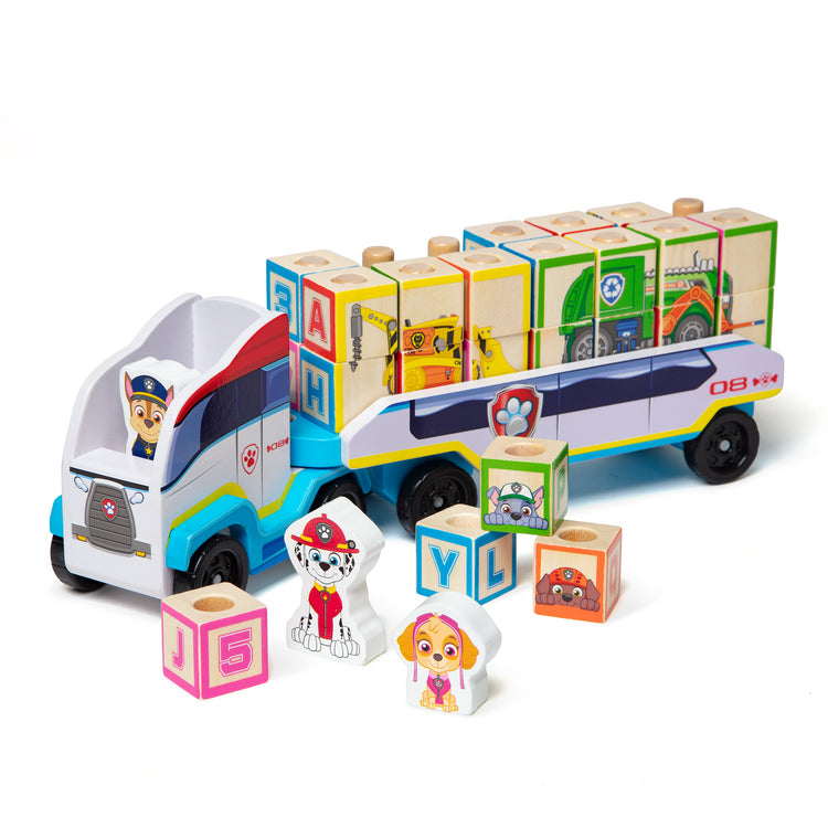 The loose pieces of The Melissa & Doug PAW Patrol Wooden ABC Block Truck (33 Pieces)