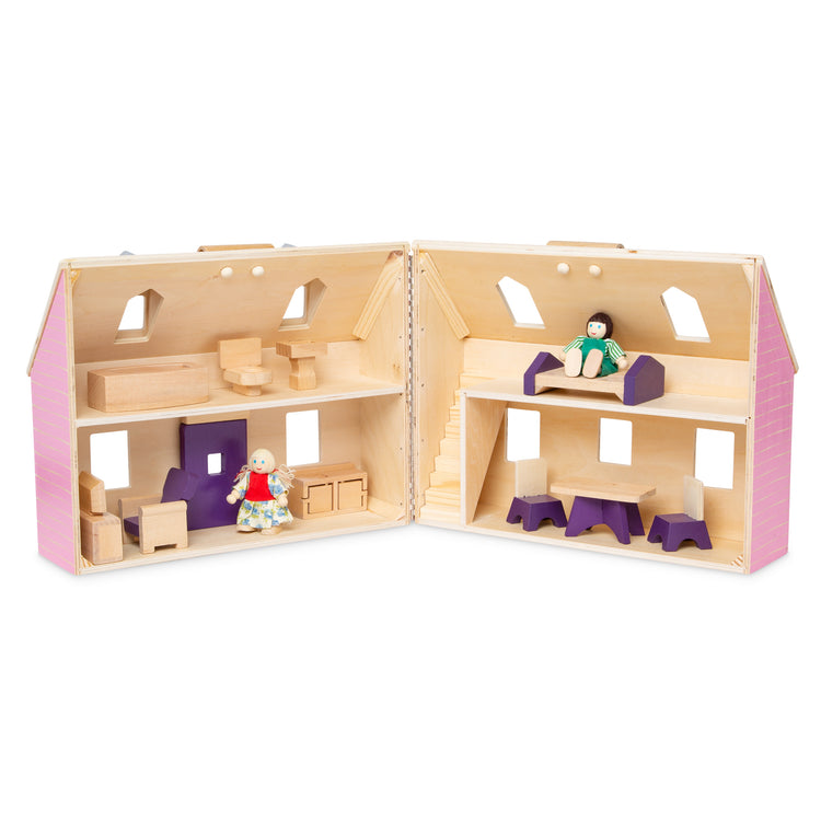 The loose pieces of The Melissa & Doug Fold and Go Wooden Dollhouse With 2 Dolls and Wooden Furniture