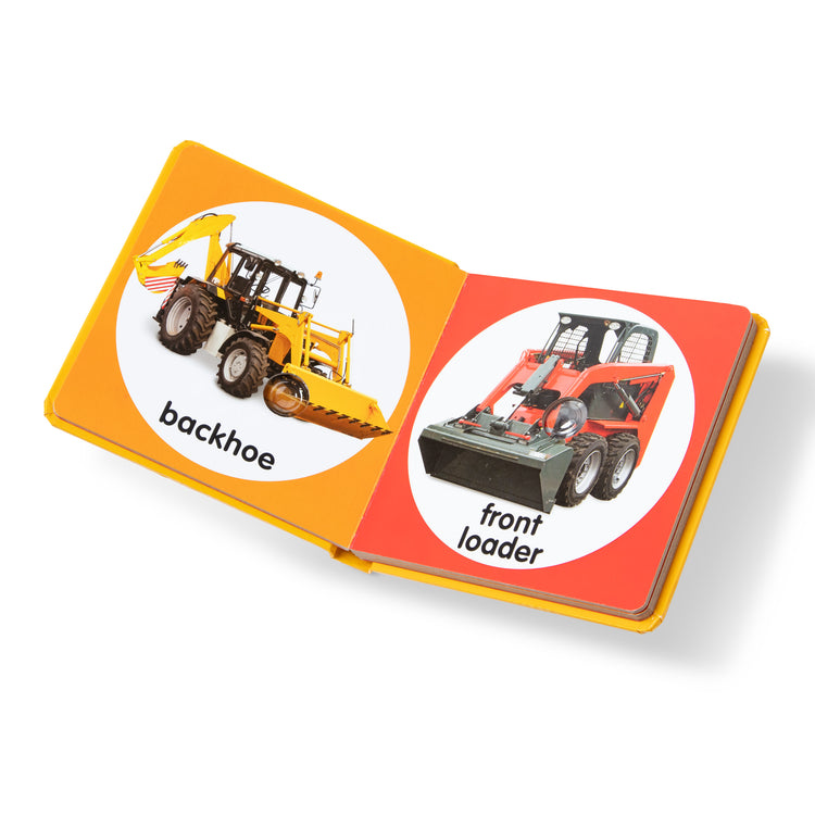 The loose pieces of The Melissa & Doug Children’s Book – Poke-a-Dot: Construction Vehicles (Board Book with Buttons to Pop)