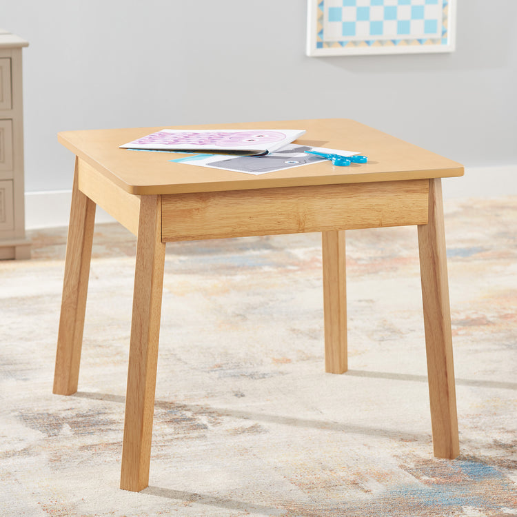 A playroom scene with The Wooden Square Table (Natural)