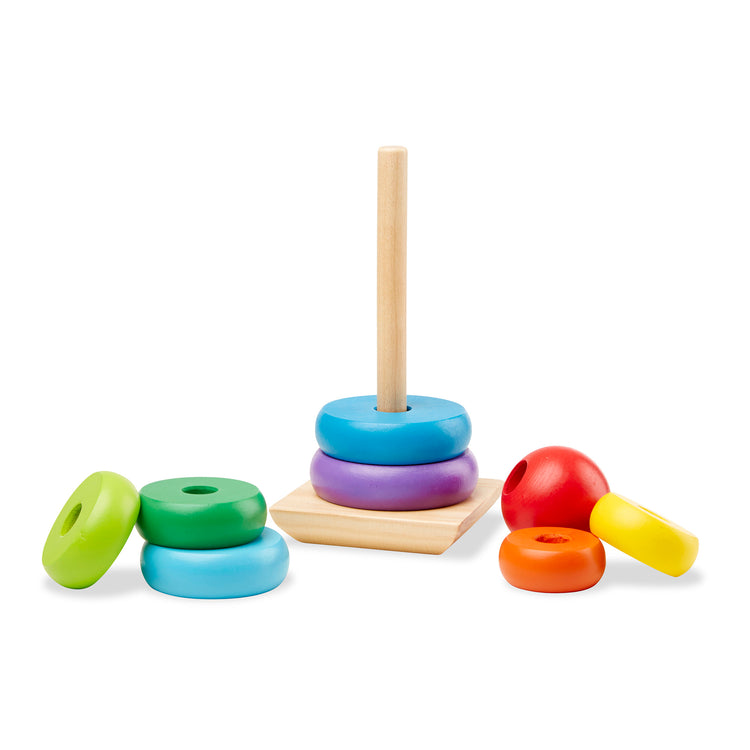 The loose pieces of The Melissa & Doug Rainbow Stacker Wooden Ring Educational Toy