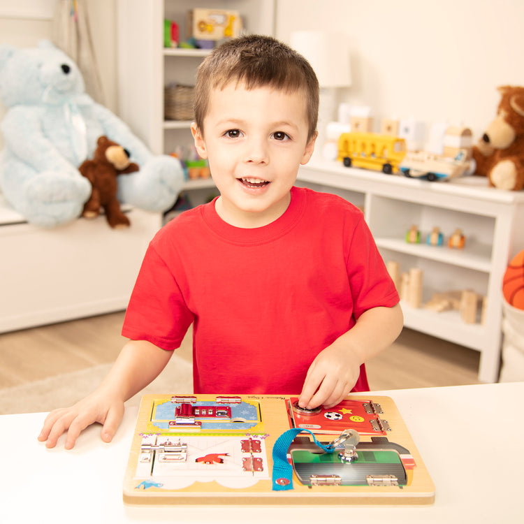 A kid playing with The Melissa & Doug Locks and Latches Board Wooden Educational Toy