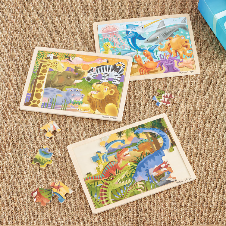 A playroom scene with The Melissa & Doug Jigsaw Puzzle Bundle (Dinosaur,Safari and Ocean)