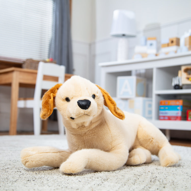 A playroom scene with The Melissa & Doug Lifelike Plush Yellow Lab Puppy Stuffed Animal