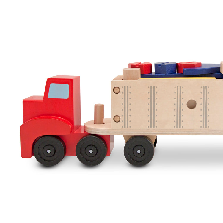 An assembled or decorated The Melissa & Doug Wooden Big Rig Truck Building Set (22 pcs)