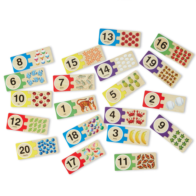 The loose pieces of The Melissa & Doug Self-Correcting Wooden Number Puzzles With Storage Box (40 pcs)