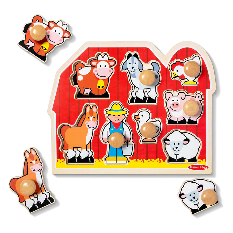 The loose pieces of The Melissa & Doug Farm Animals Jumbo Knob Wooden Puzzle