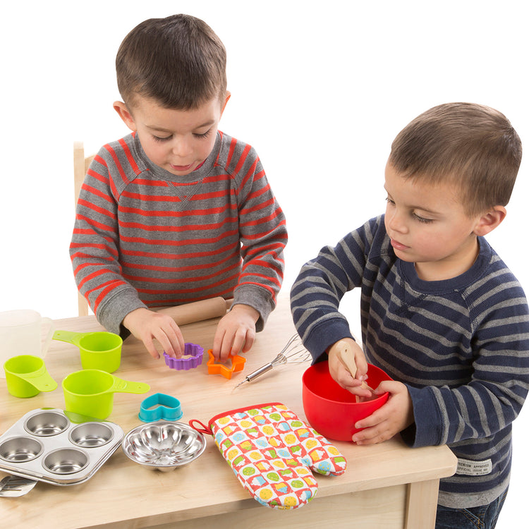 A child on white background with The Melissa & Doug Baking Play Set (20 pcs) - Play Kitchen Accessories