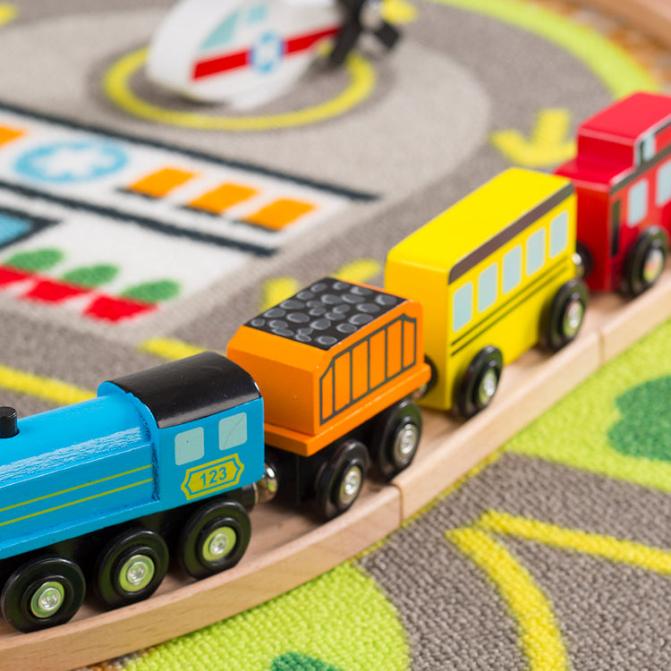  The Melissa & Doug Deluxe Multi-Vehicle Activity Rug (39.5" x 36.5") - 19 Vehicles, 12 Wooden Signs, Train Tracks